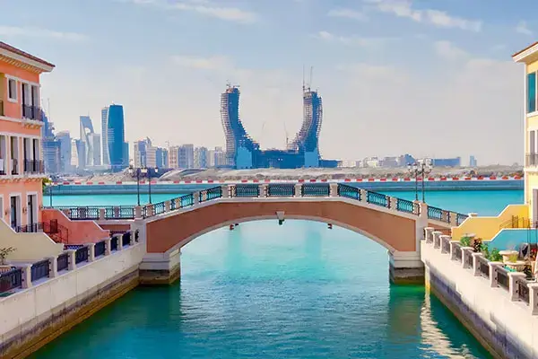 Image of Lusail Marina looking over the sea towards the katara hospitality tower in Qatar