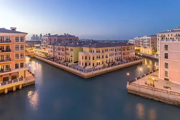 Exterior shot of buildings in front of cannals in the pearl Qatar